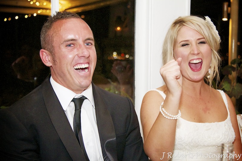 Bride and groom cheering during wedding speeches - wedding photography sydney